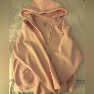 skims pink cropped zip up